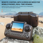 Remote control with built-in screen for aerial footage, displaying real-time desert view outdoors.