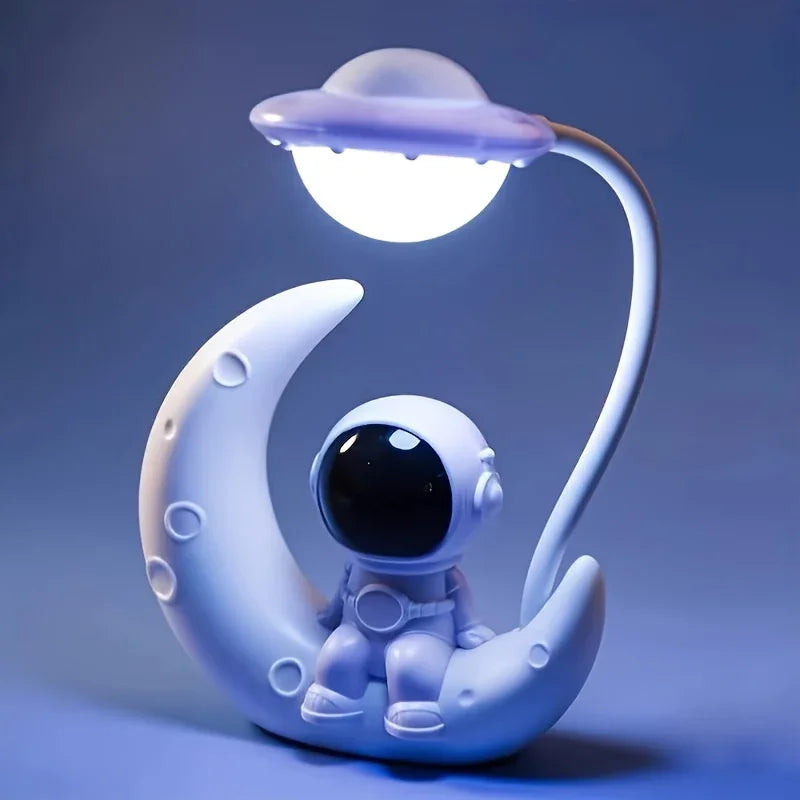 Cute astronaut figurine lamp sitting on a crescent moon with UFO-shaped LED light, nightlight