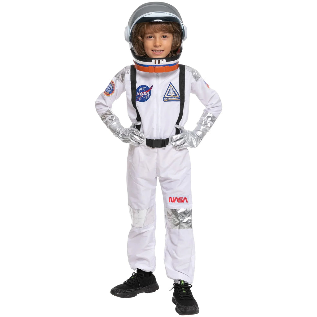 Child wearing white NASA astronaut costume and helmet, standing with hands on hips