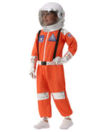 Child wearing orange astronaut costume with helmet and silver accents, standing and smiling