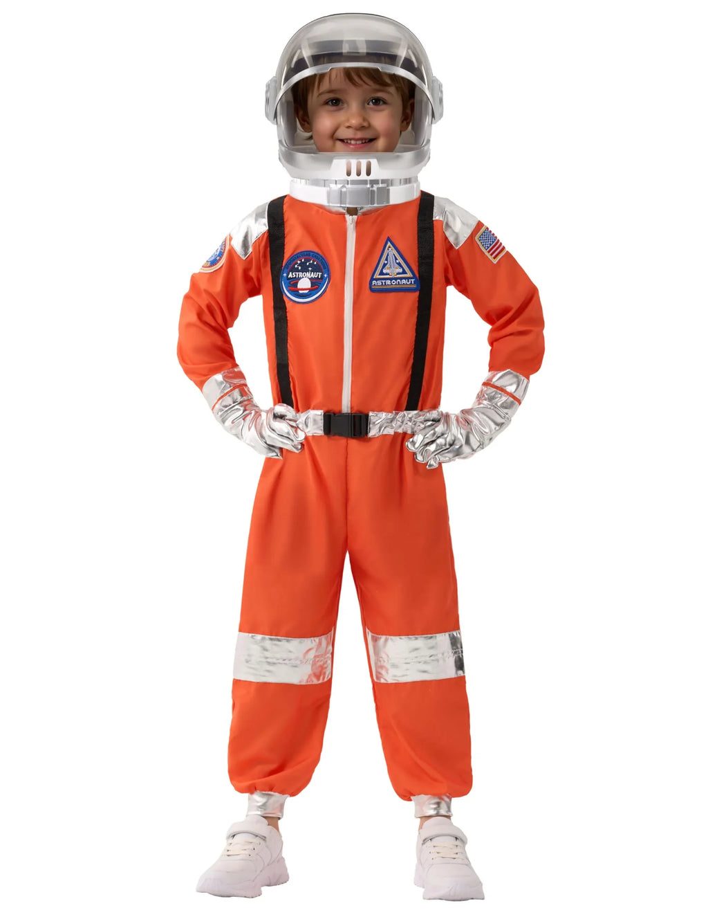 Smiling child wearing orange astronaut costume with helmet and space patches