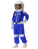 Child in a blue astronaut costume with helmet, silver accents, and mission patches