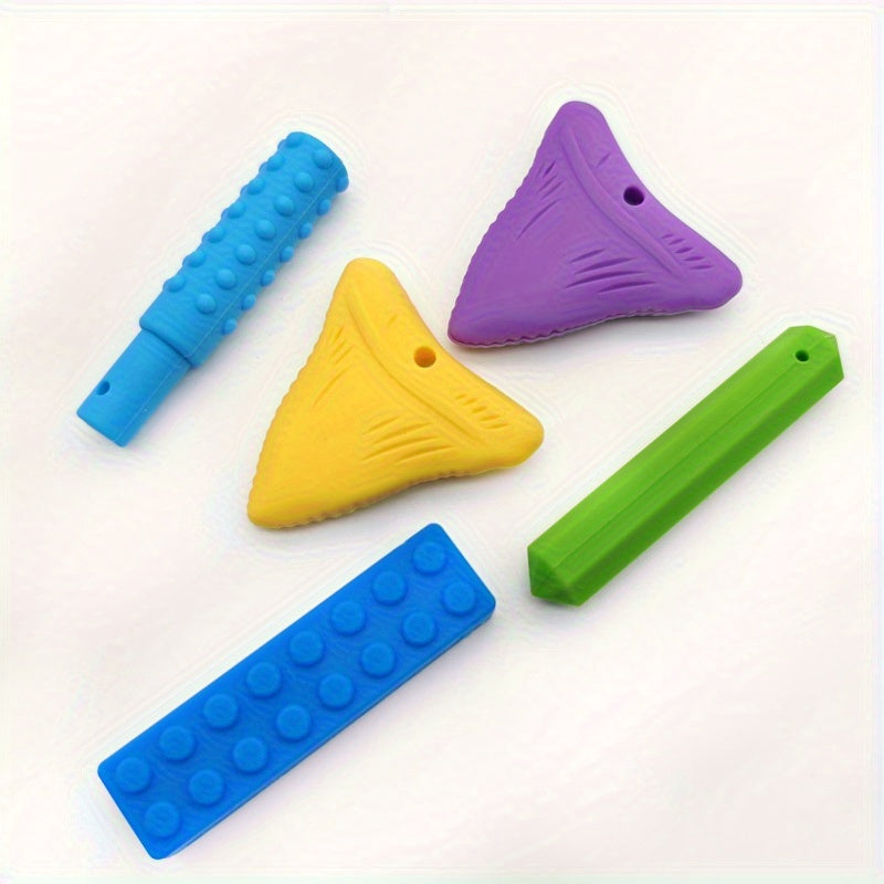 Assorted colorful sensory chew toys for kids in blue, yellow, purple, and green shapes