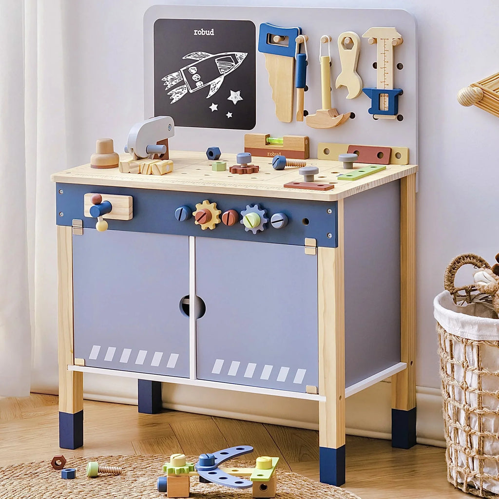 Wooden kids tool bench with toy tools, gears, and chalkboard, educational playset in room