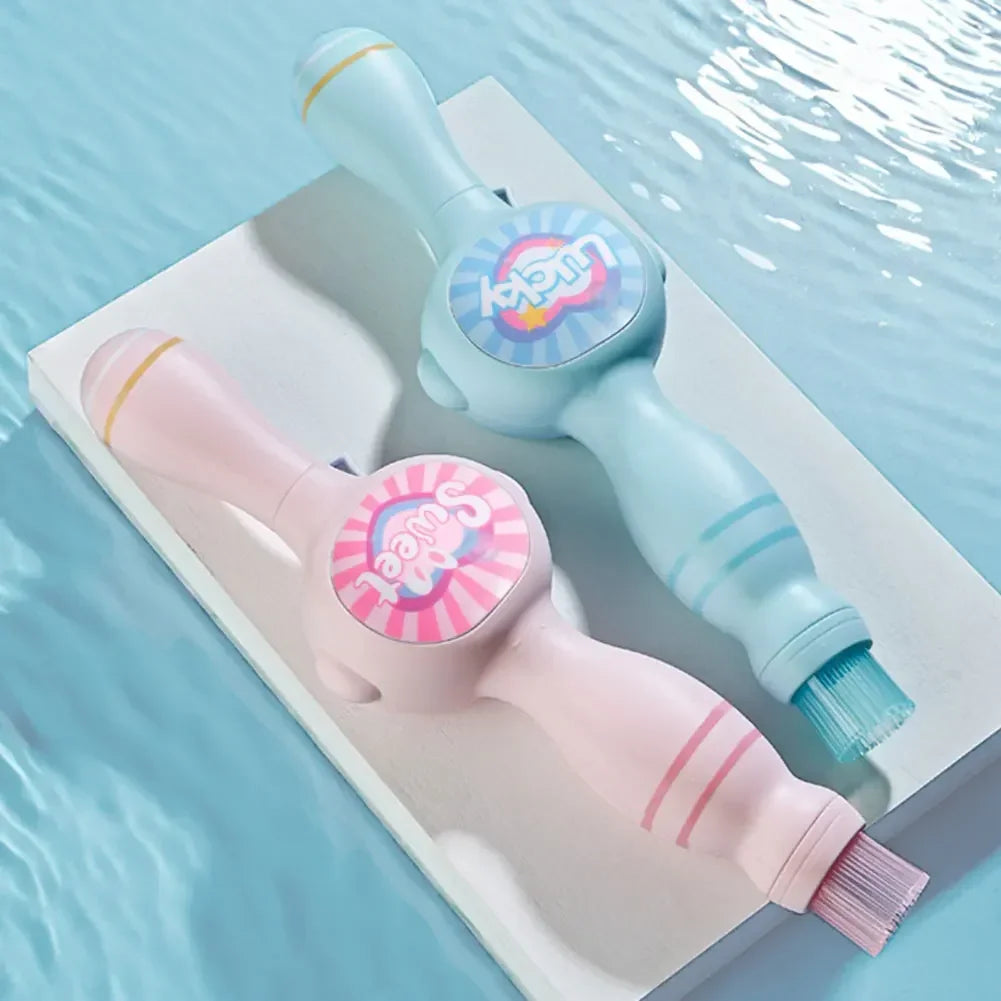 Pastel blue and pink double-ended cleaning brushes with playful 'Lucky' and 'Sweet' labels by a pool.