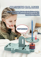Child using magnetic balance educational toy for nut weighing, Rekotech innovative STEM toy