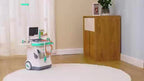STEM toy medical cart with tools and monitor for kids, on a rug in a bright room