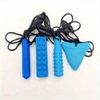 Set of four blue sensory chewable pendant necklaces with various textured shapes.