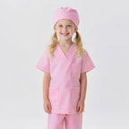 Smiling girl in pink science lab uniform with cap, promoting STEM and science learning toys