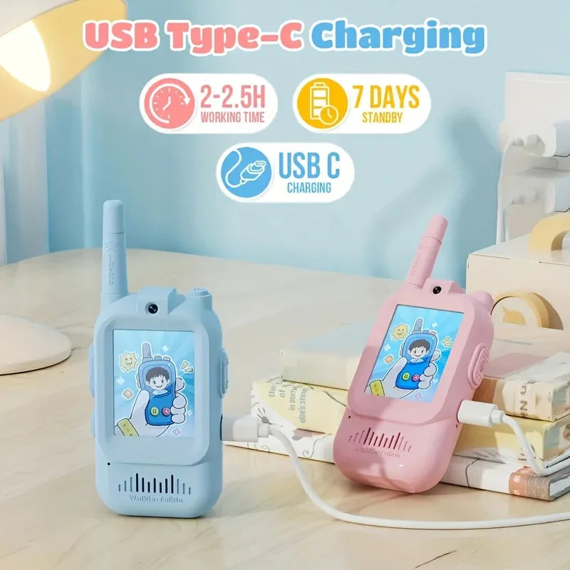 Blue and pink kids walkie talkies with cartoon screens, USB Type-C charging on desk