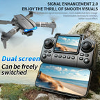 Foldable drone with camera, dual screen controller, and smartphone display on rocky outdoor setting.