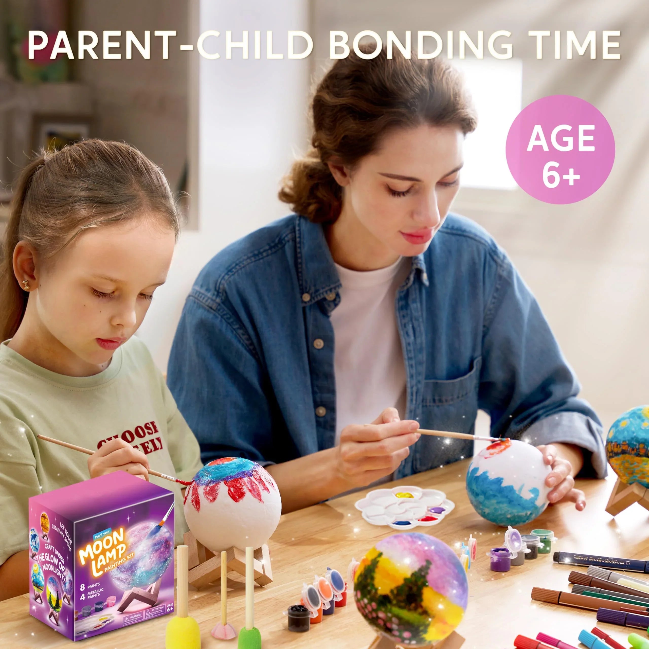 Parent and child painting 3D moon lamp craft kit together, ideal for ages 6 and up.